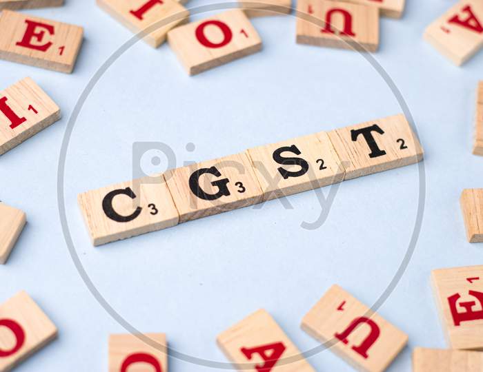 Assam, india - March 30, 2021 : Word GST written on wooden cubes stock image.