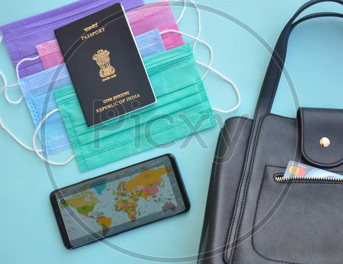 Mandi, Himachal Pradesh, India - 04 24 2021: Overhead view of essential items for international travel during pandemic for a women