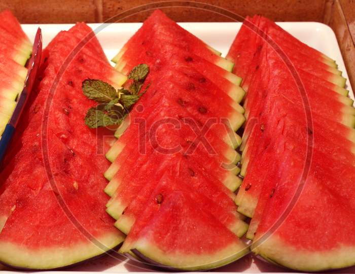 Watermelon slices and mint leaves close-up