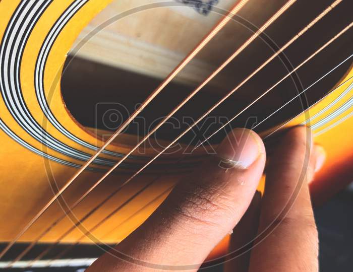 Sunburst Acoustic Guitar on white background and space for text