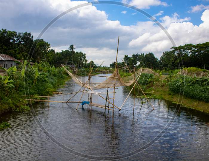 Image of Fishing Nets Made Of Bamboo. A Beautiful River View Of