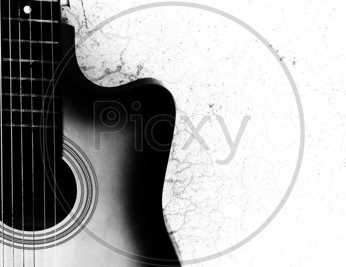 A silhouette photograph of a acoustic guitar with space for text