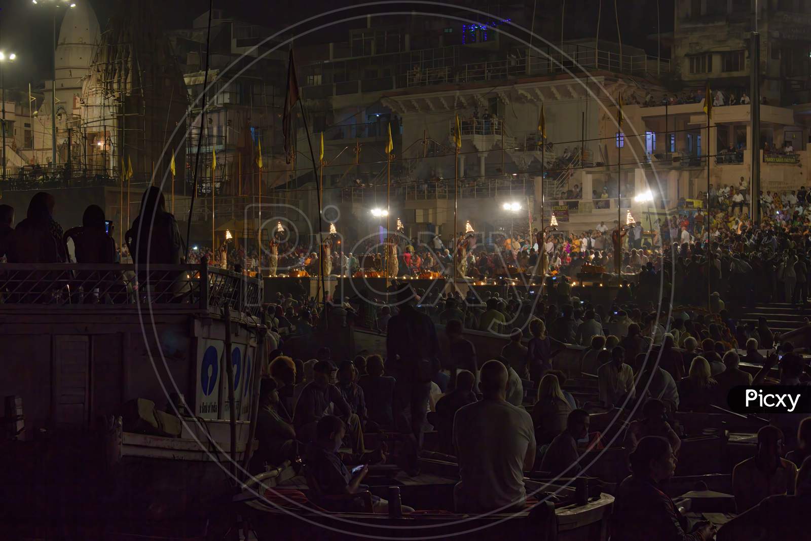 Varanasi, India - November 01,2016: Wide Angle Shot Of Ganga Aarti Ceremony Rituals Performed By Hindu Priests At Dashashwamedh Ghat In Varanasi Uttar Pradesh And Tourist And People Crowd
