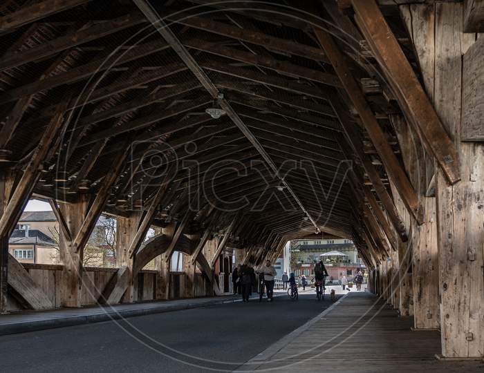 Medieval Wooden Bridge Of Bremgarten Over Reuss River At Day Time.