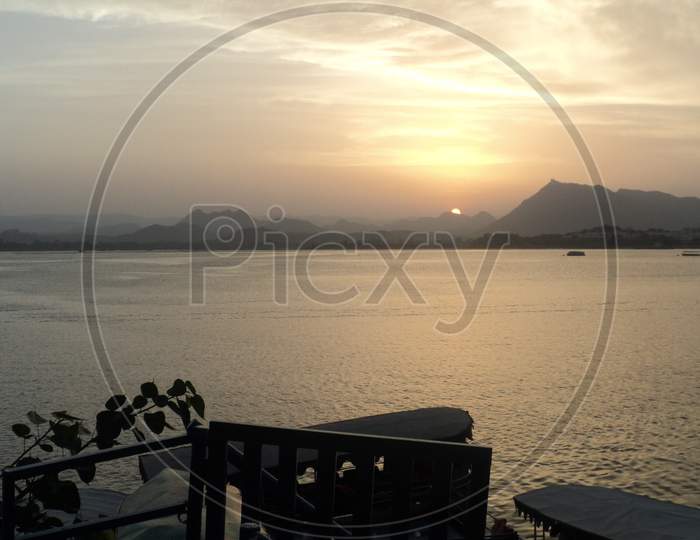 A picture of sunset in the Aravalli Mountains, taken from around the Pichola Lake Near City Palace.