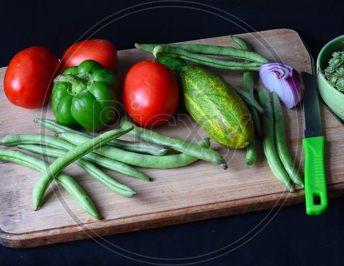 Vegetables On Chopping Board, Tomatoes, Bell Pepper, Beans .