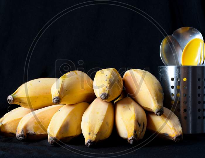 Yellow Ripe Bananas And Cutlery