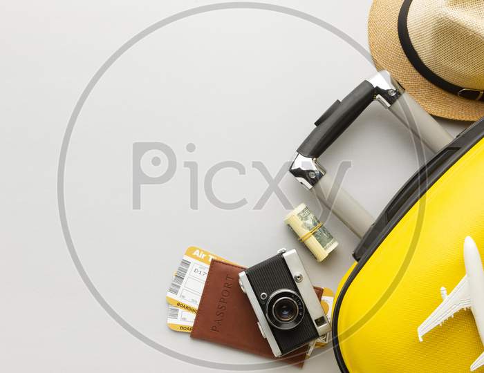 flat lay yellow luggage with copy space