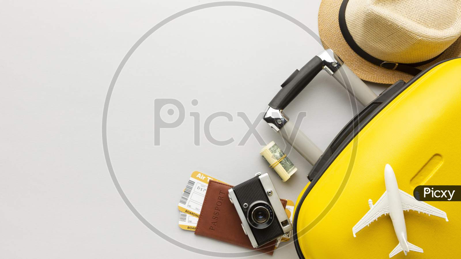 flat lay yellow luggage with copy space