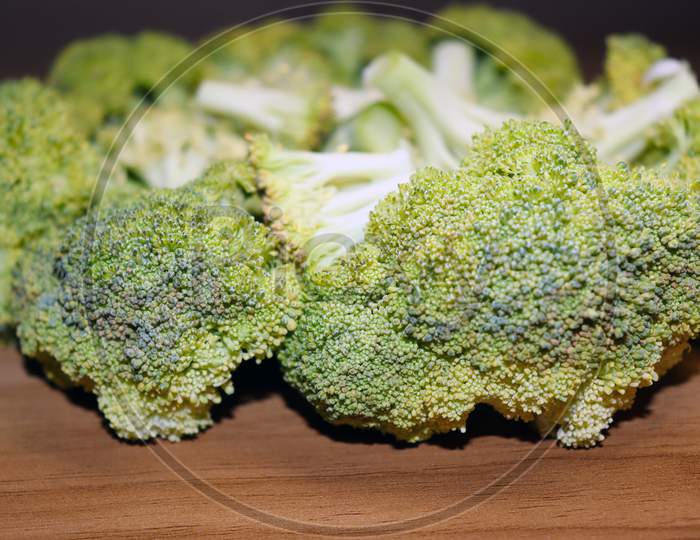 Sliced Broccoli Stock On Wooden Table
