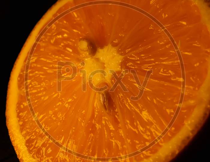 Closeup of fresh morning dew covered orange slices to eat for breakfast