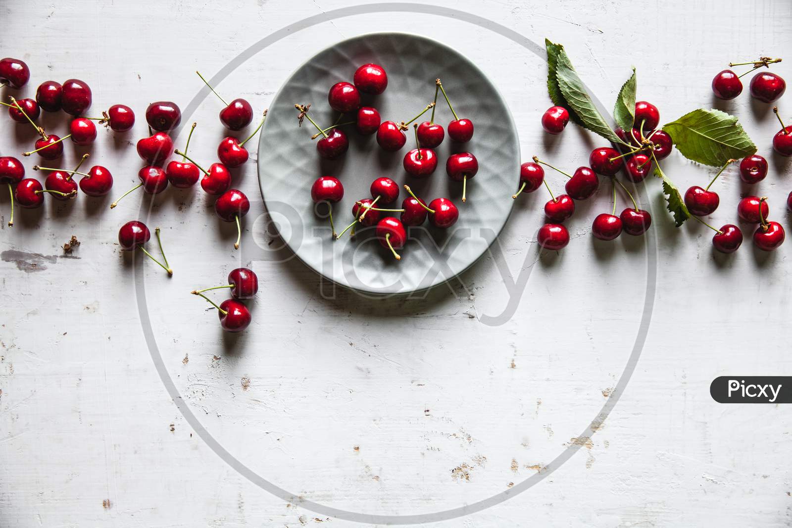 Sweet Cherries In A Plate On An Old White Background, Healthy Food, Fruits