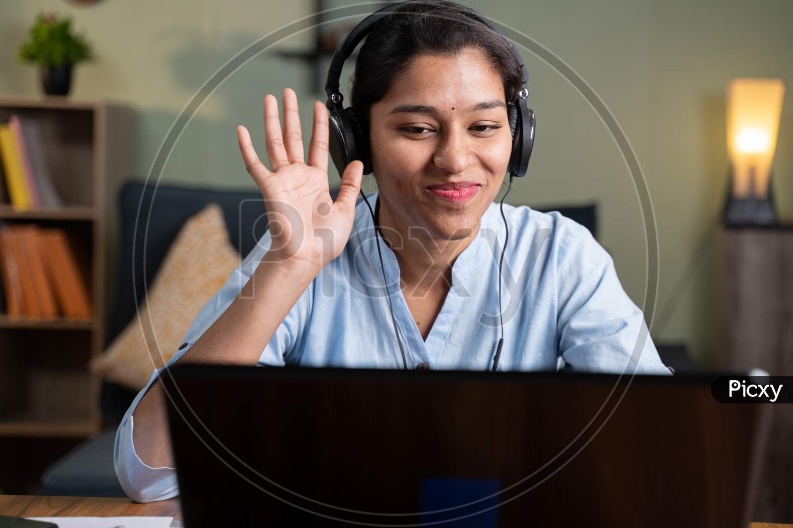 Image of Young Business Woman On Online Meeting By Greeting Hai On Video  Conference While Working From Home - Concept Of Video Chat, Conference Or  Vlogging From Home By Looking At Camera.-WT268429-Picxy