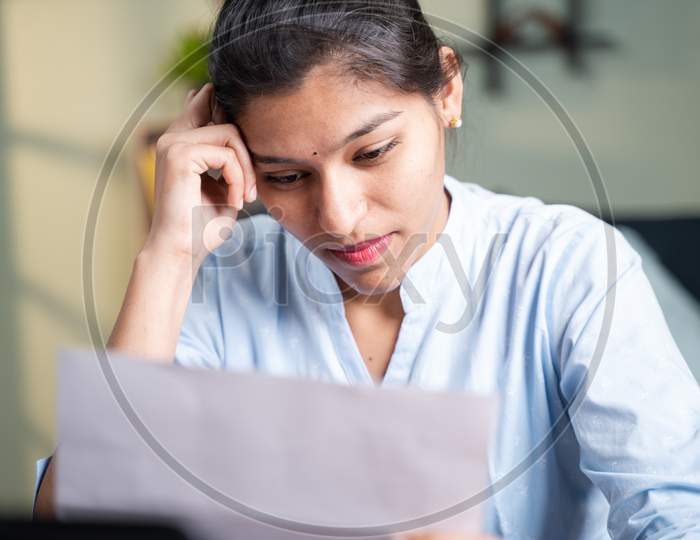 Worried Young Business Woman Due To Eviction Notice After Reading Letter - Concept Of Disappointment Due To Bad News, Unemployment, Job Termination And Bill Payment.