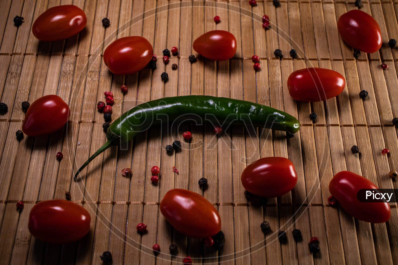 Chilli Pepper An Cherry Tomatoes Background.