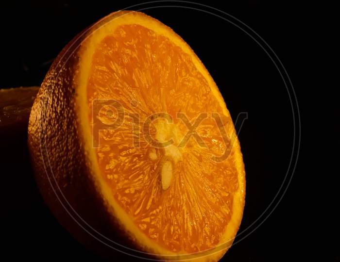 Closeup of fresh morning dew covered orange slices to eat for breakfast