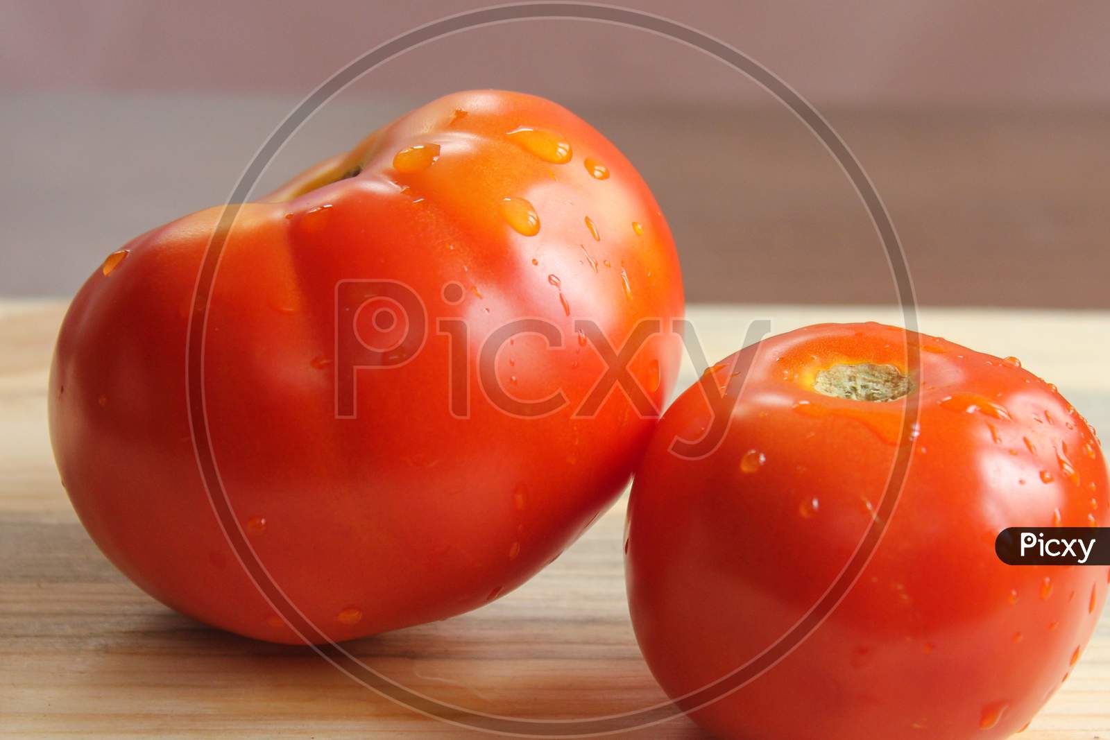 Tomatos On Top Of The Table  Stock Photo