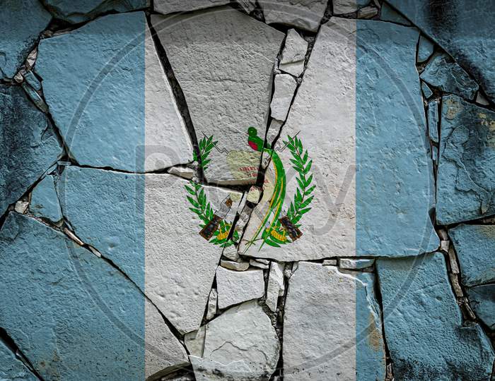 National Flag Of Guatemala
 Depicting In Paint Colors On An Old Stone Wall. Flag  Banner On Broken  Wall Background.