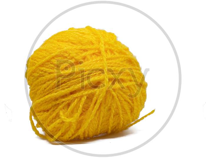 Yellow Woolen Ball On White Background. Use To Make Woolens For Winters.