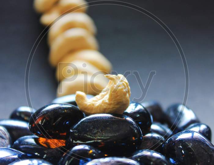 Close Up Of Cashew Nut On Dark Background