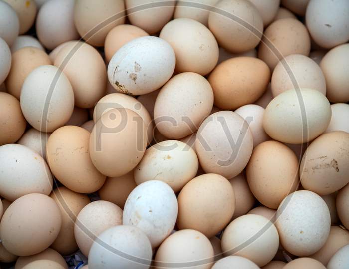 Close-Up Brown And White  Eggs , Top View. Real Farm Chicken Eggs