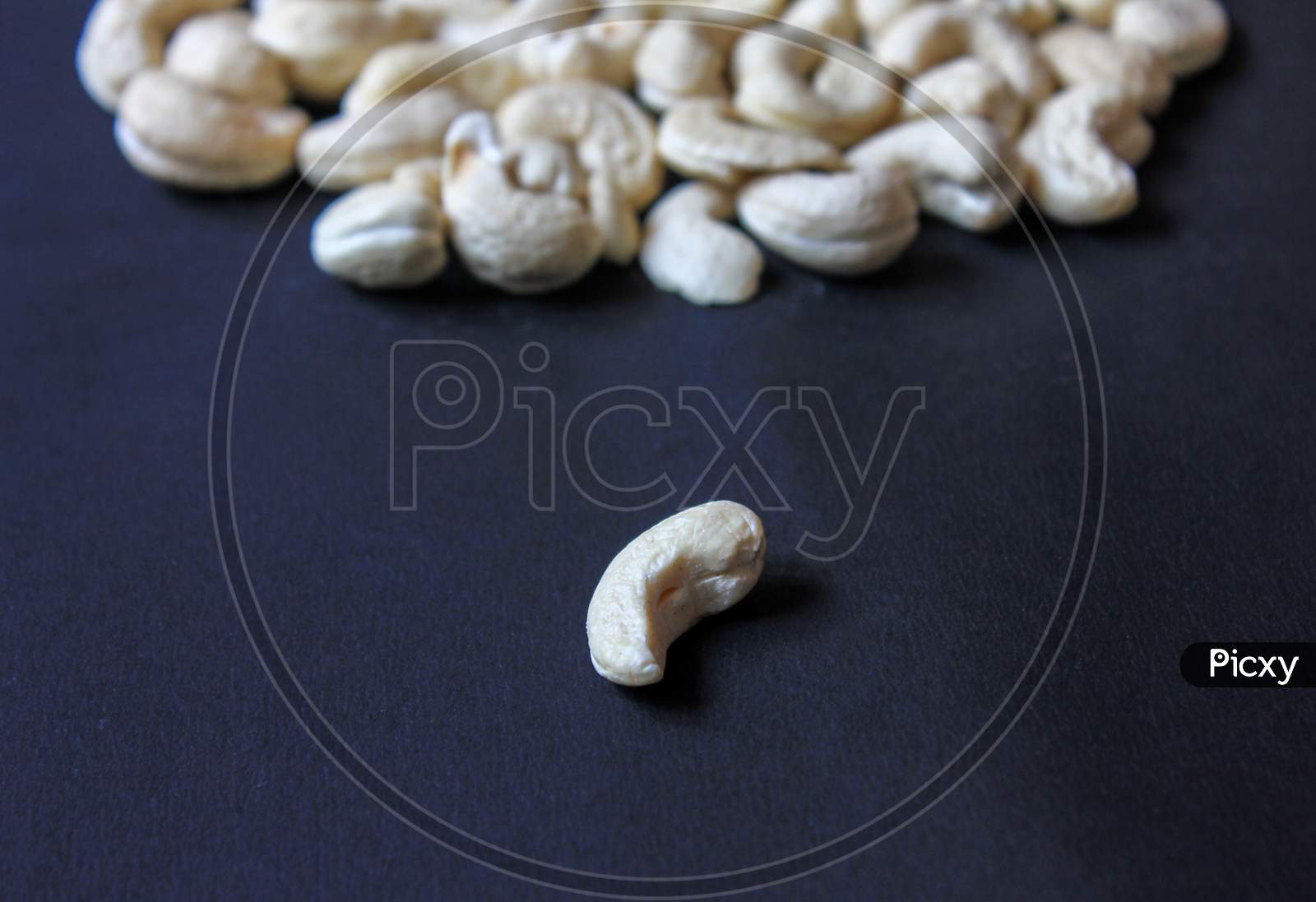 Cashew Nuts Isolated In A Dark Background