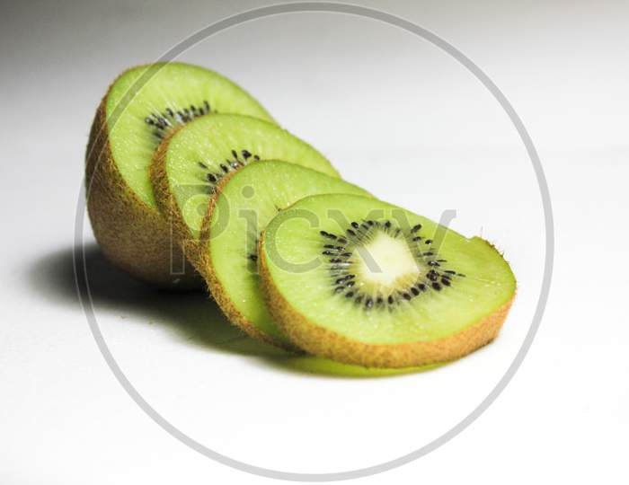 Cut Kiwi Fruit On A Table