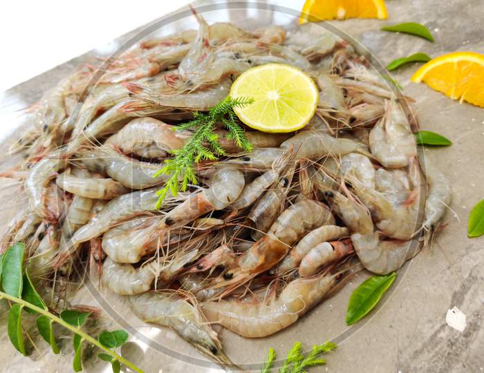 Fresh White Prawns Decorated With Herbs And Fruits.Selective Focus.