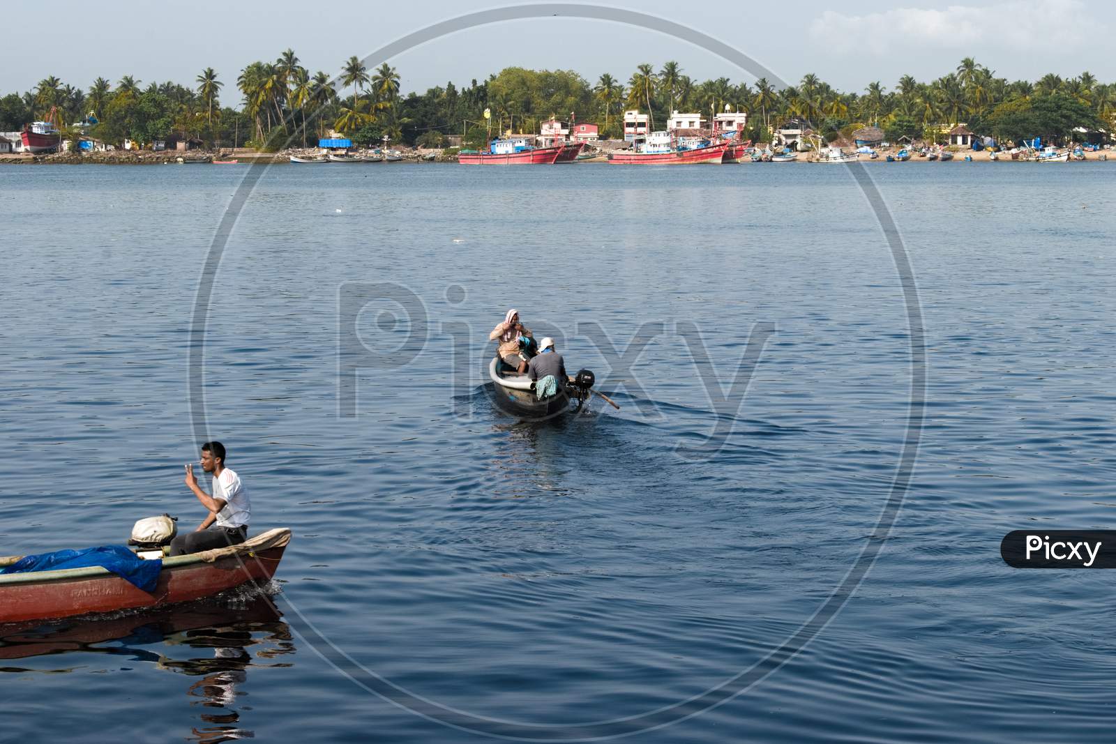 "Mangalore, Karnataka, India - April 2Nd 2021 : Indian Fishermen With Their Boat On The River Ready For Fishing"