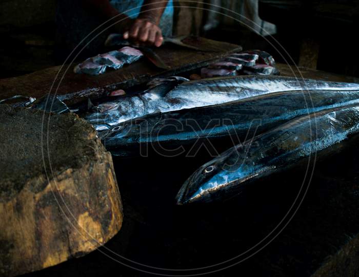 King Mackerel Fish On A Stall Ready To Undergo Cutting And Cleaning Process.