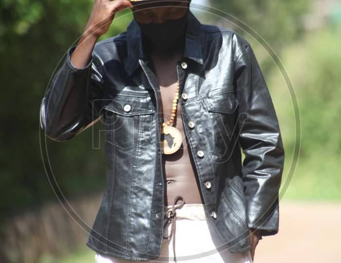 Covid 19 African young man in his mask black keep your mask on stay safe