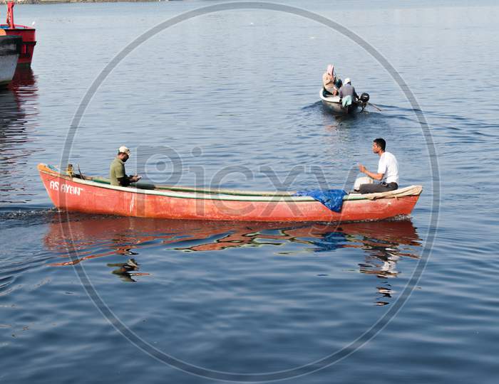 "Mangalore, Karnataka, India - April 2Nd 2021 : Indian Fishermen With Their Boat On The River Ready For Fishing"