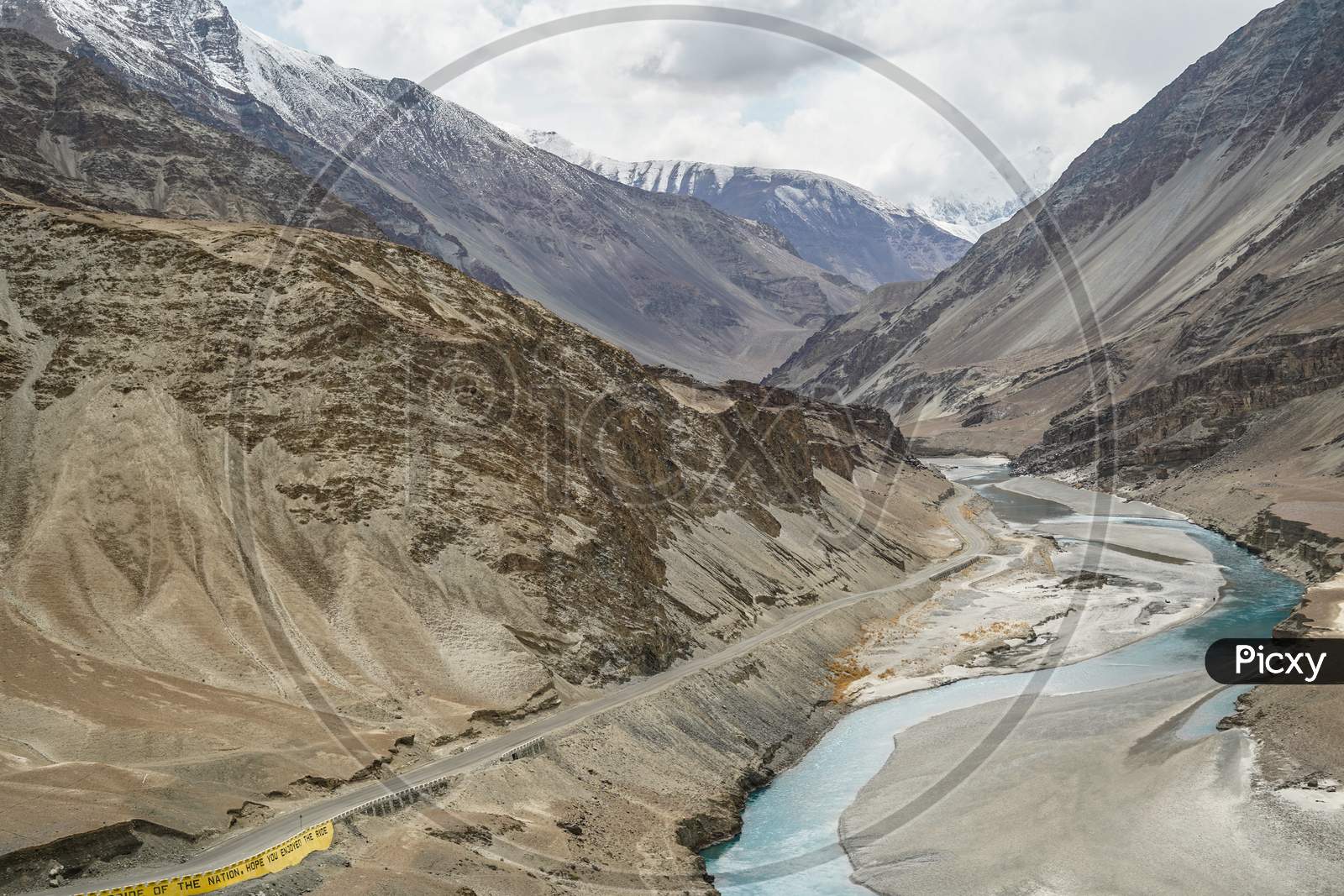 Aerial View Of A River Meeting Another River With Different Color At A Sangam In Indus Valley In Ladakh.