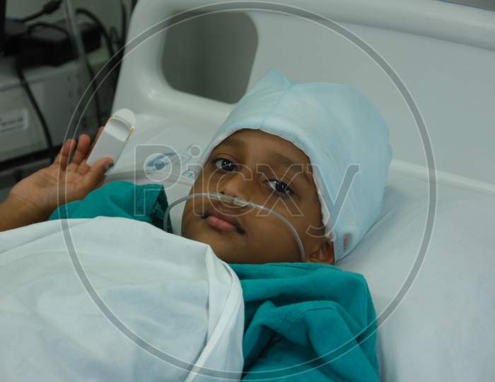 Girl with Oxygen Nasal Tube in hospital