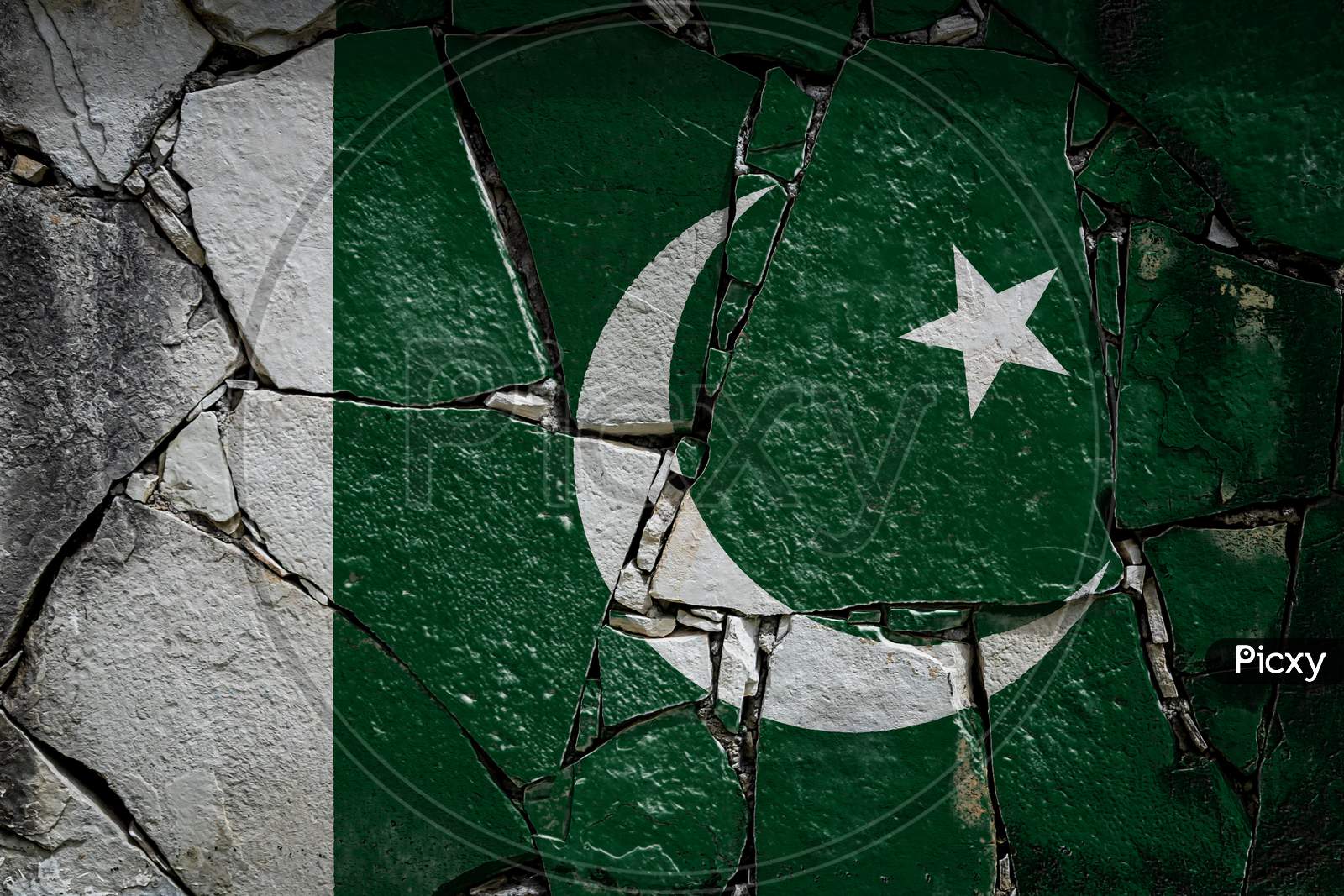 National Flag Of Pakistan  Depicting In Paint Colors On An Old Stone Wall. Flag  Banner On Broken  Wall Background.