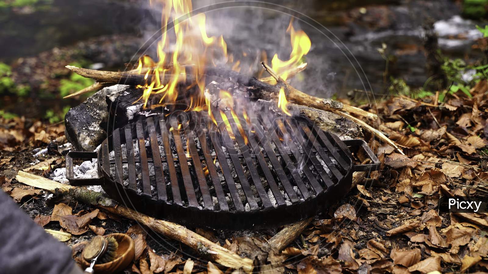 Blank Flaming BBQ Charcoal Grill, Closeup. Hot Barbeque Grill Ready Cooking Food On Cast Iron Grate. Concept For Cookout, Barbecue Party At Garden Or Backyard. Grill With Bright Flames Black Isolated.
