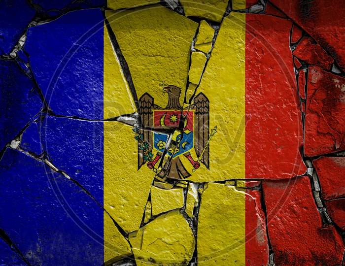 National Flag Of Moldova Depicting In Paint Colors On An Old Stone Wall. Flag  Banner On Broken  Wall Background.