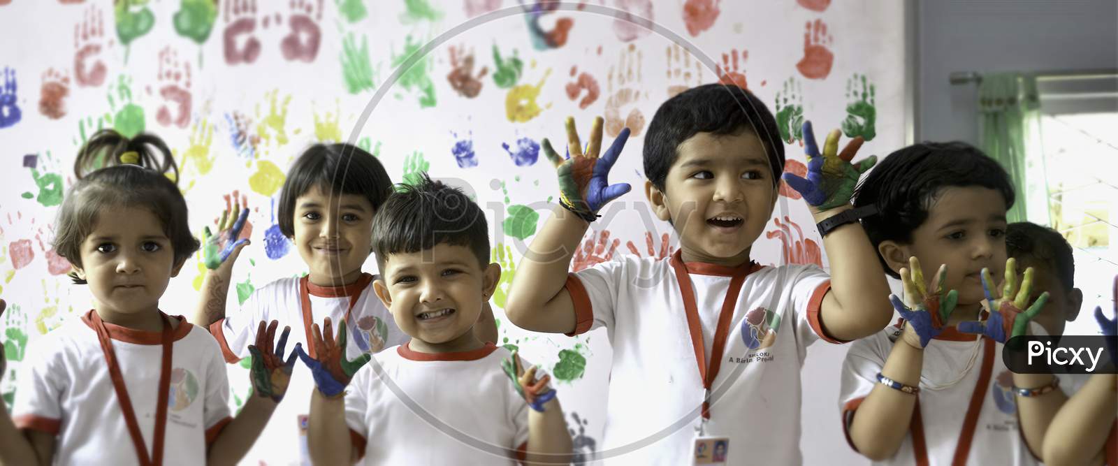 Indian Children drawing in the nursery . color in the hand of children.