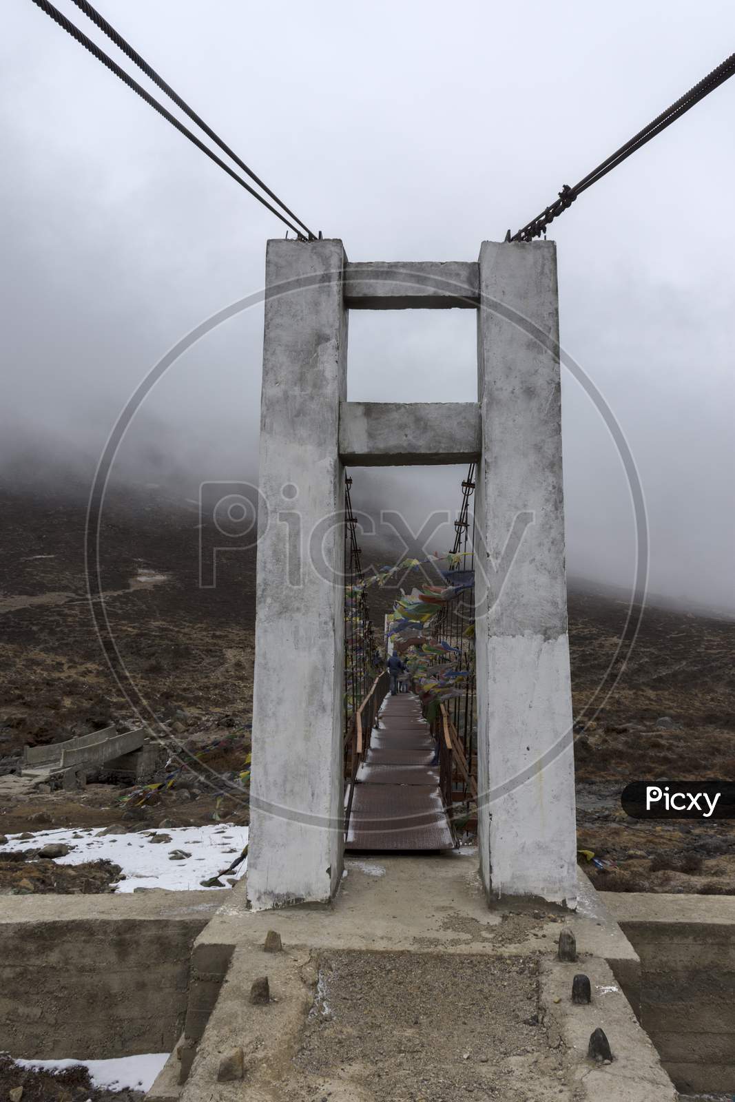 A Big Gate In Front Of An Iron Bridge On The Way To Gurudongmar Lake North Sikkim.