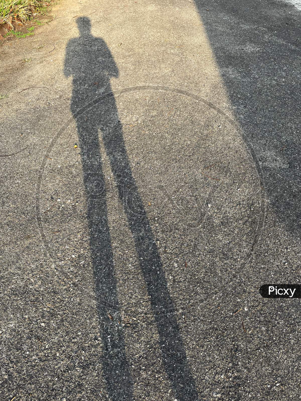 Image Of Shadow Of Human On Ground.