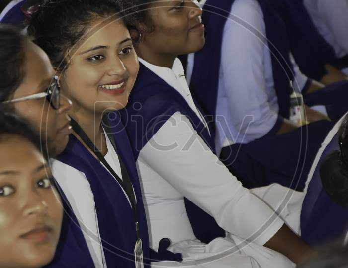 Image of Indian school girl student in uniform. School students sitting on  floor studying inside classroom.-MY949327-Picxy