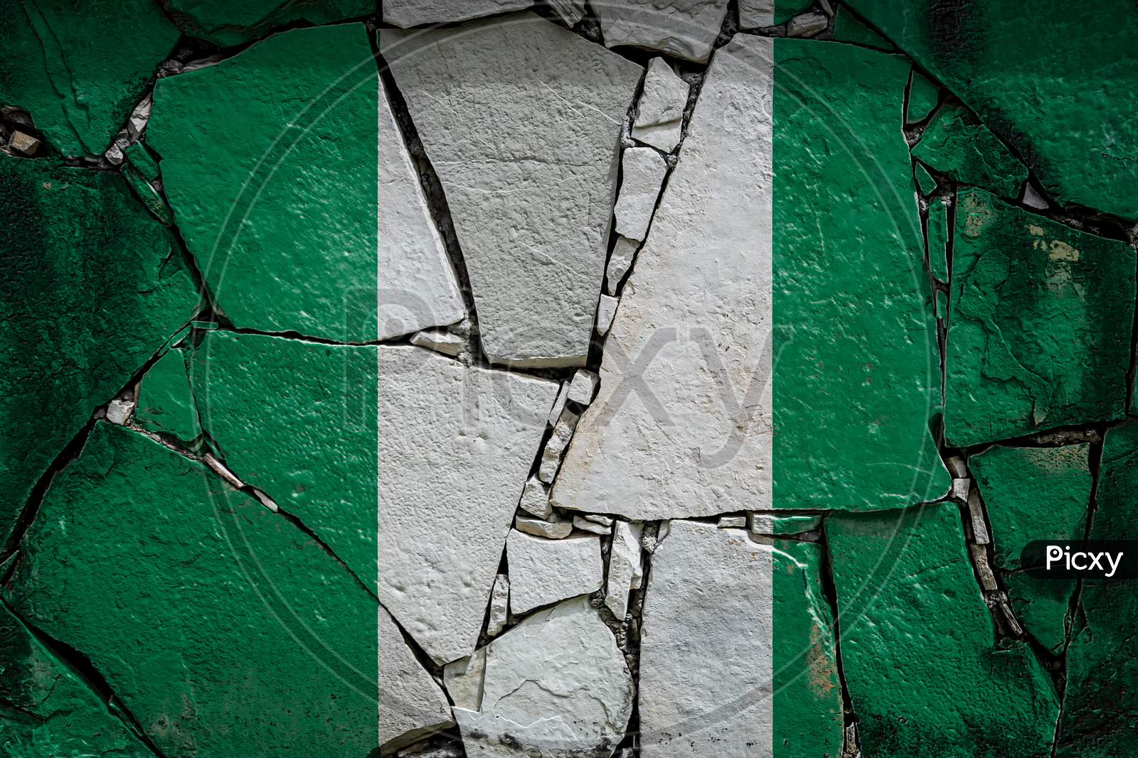 National Flag Of Nigeria Depicting In Paint Colors On An Old Stone Wall. Flag  Banner On Broken  Wall Background.