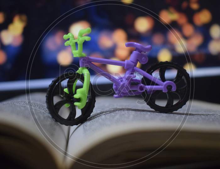 small toy with a background on a book