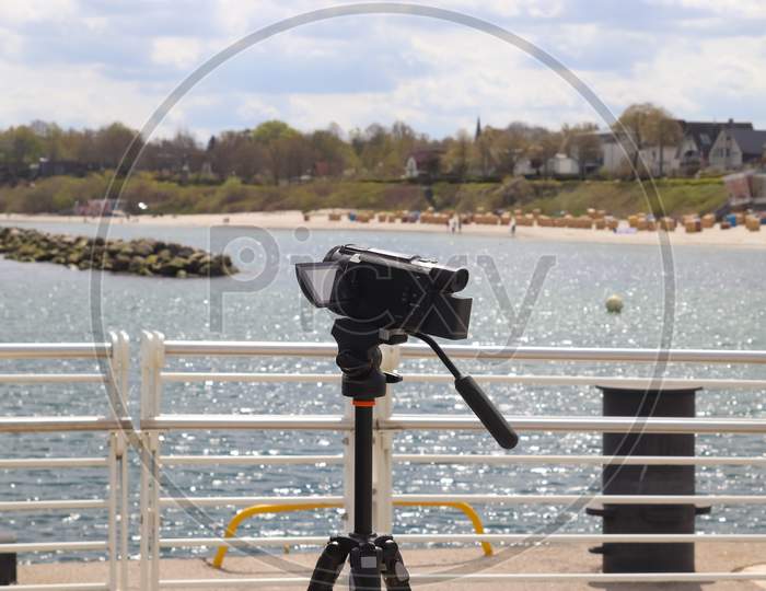 Selective Focus View At A Camera Filming At A Yacht Port In Kiel In Germany