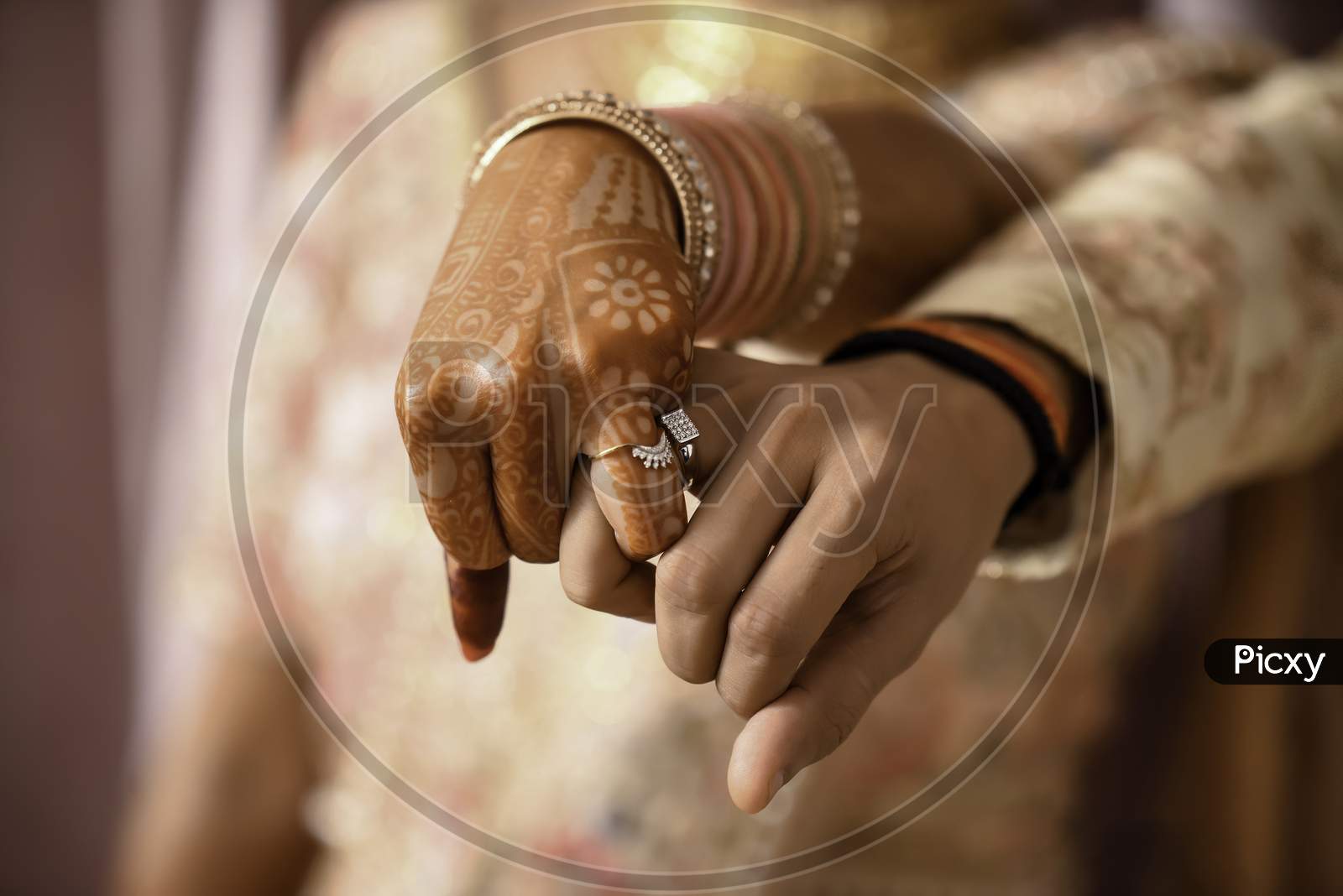 Beautiful Indian bride and groom hand with mehandi design. Selective focus