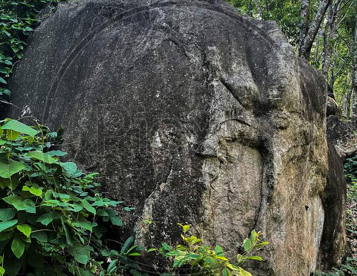 Image Of A Isolated Big Rock On Hillside.