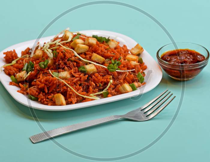 Schezwan Paneer Fried Rice With Schezwan Sauce,Chinese Fried Rice With Paneer,Garnished With Spring Onion And Cabbage