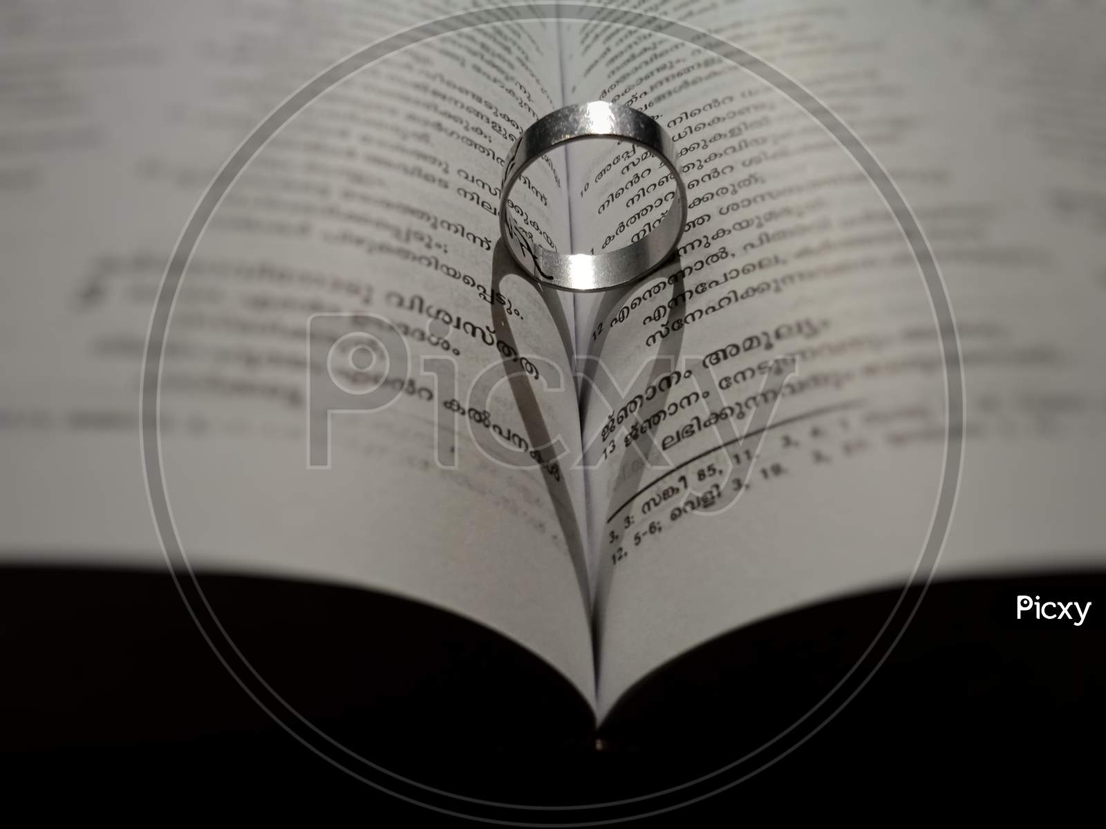 Ring and a heart on a book