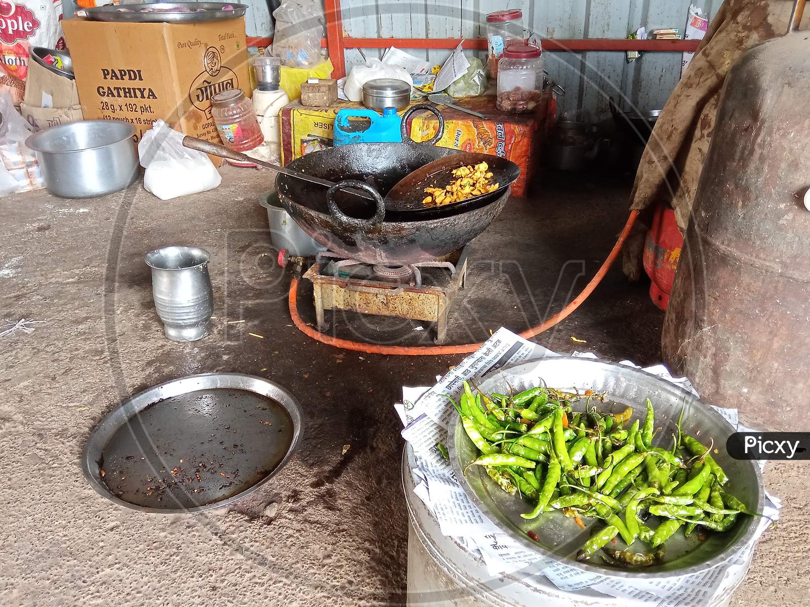 Indian highway road side village restaurant fresh fried kanda bhajji with fried chillies