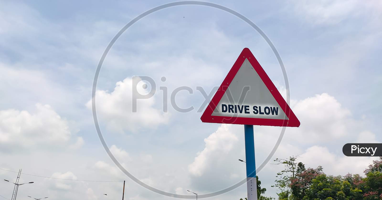 Traffic Rules And Signs Board On Road For Drive Slow For The Driver As Warning.